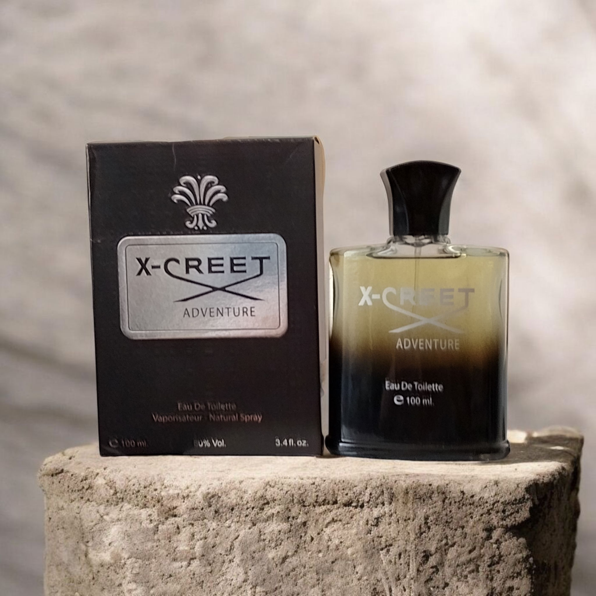 ادکلن بدون سلفون مردانه تی آر آی مدل ایکس کریت اونتوس X-Creet Adventure حجم 100 میلی لیتر